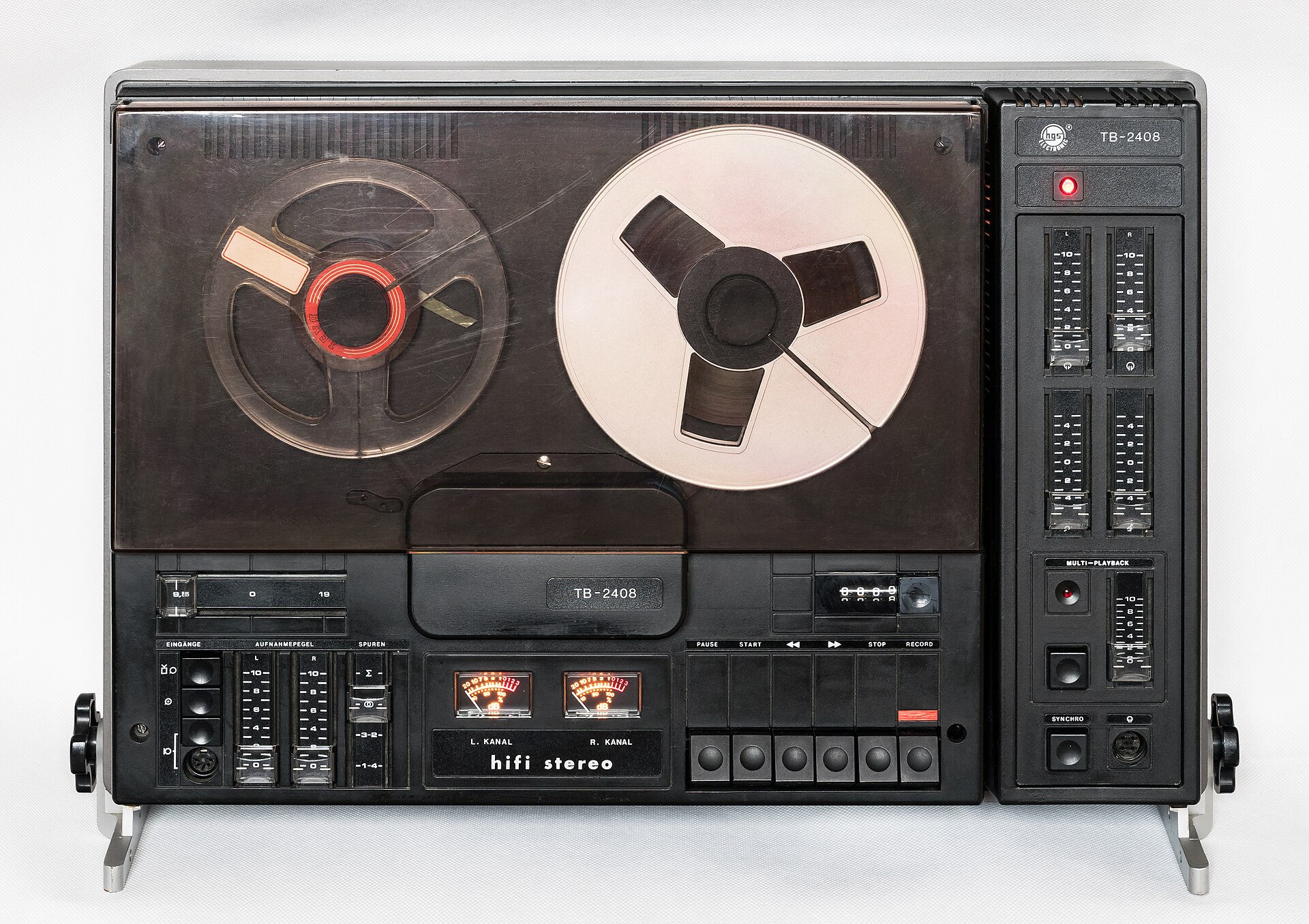 A reel-to-reel tape recorder with two reels and level meters